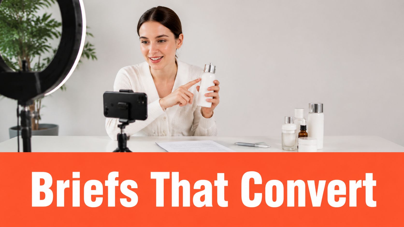 A smiling female content creator recording a product review for ecommerce marketing with her smartphone.