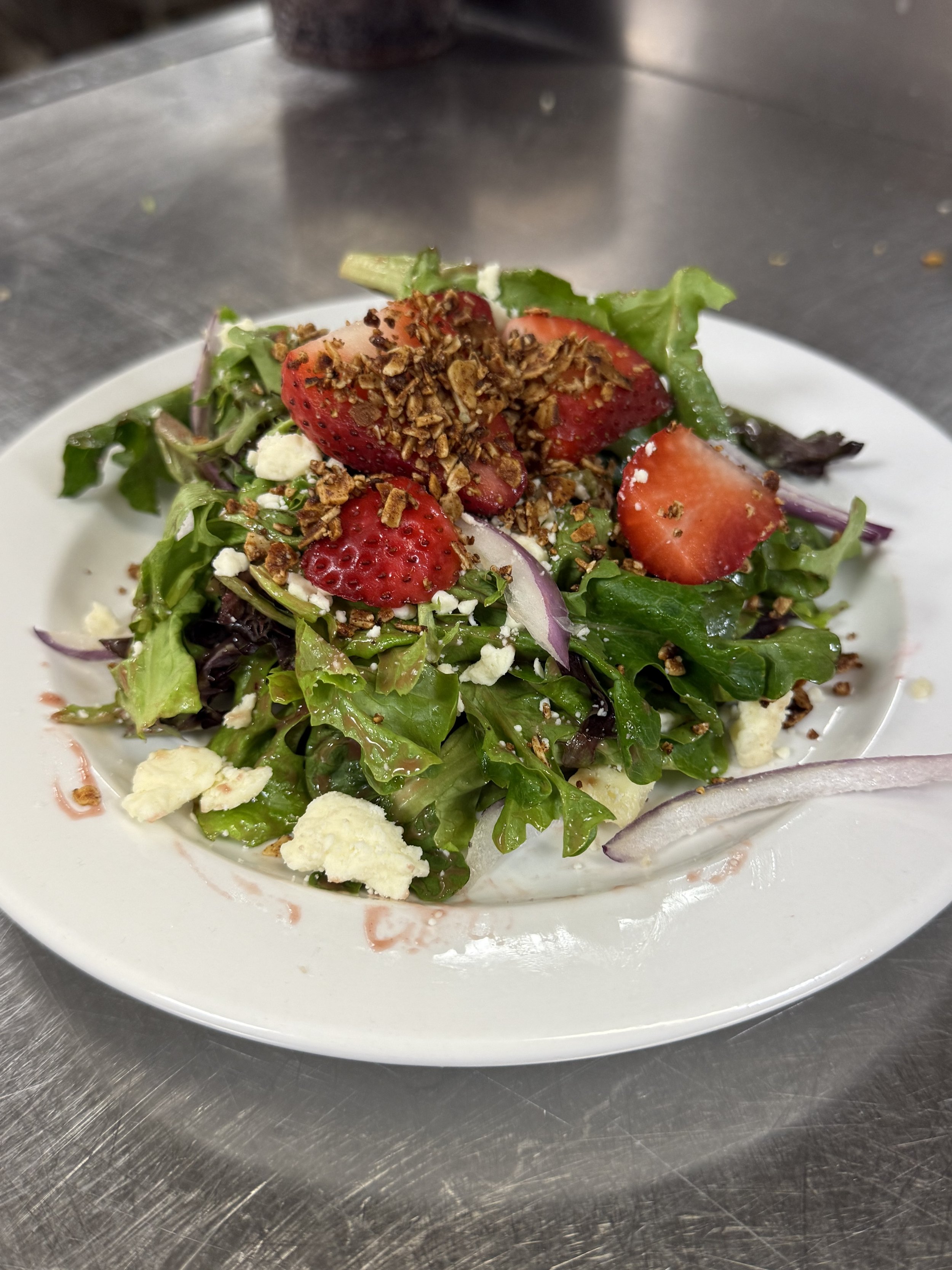 Strawberry salad plated at Prairie Canary