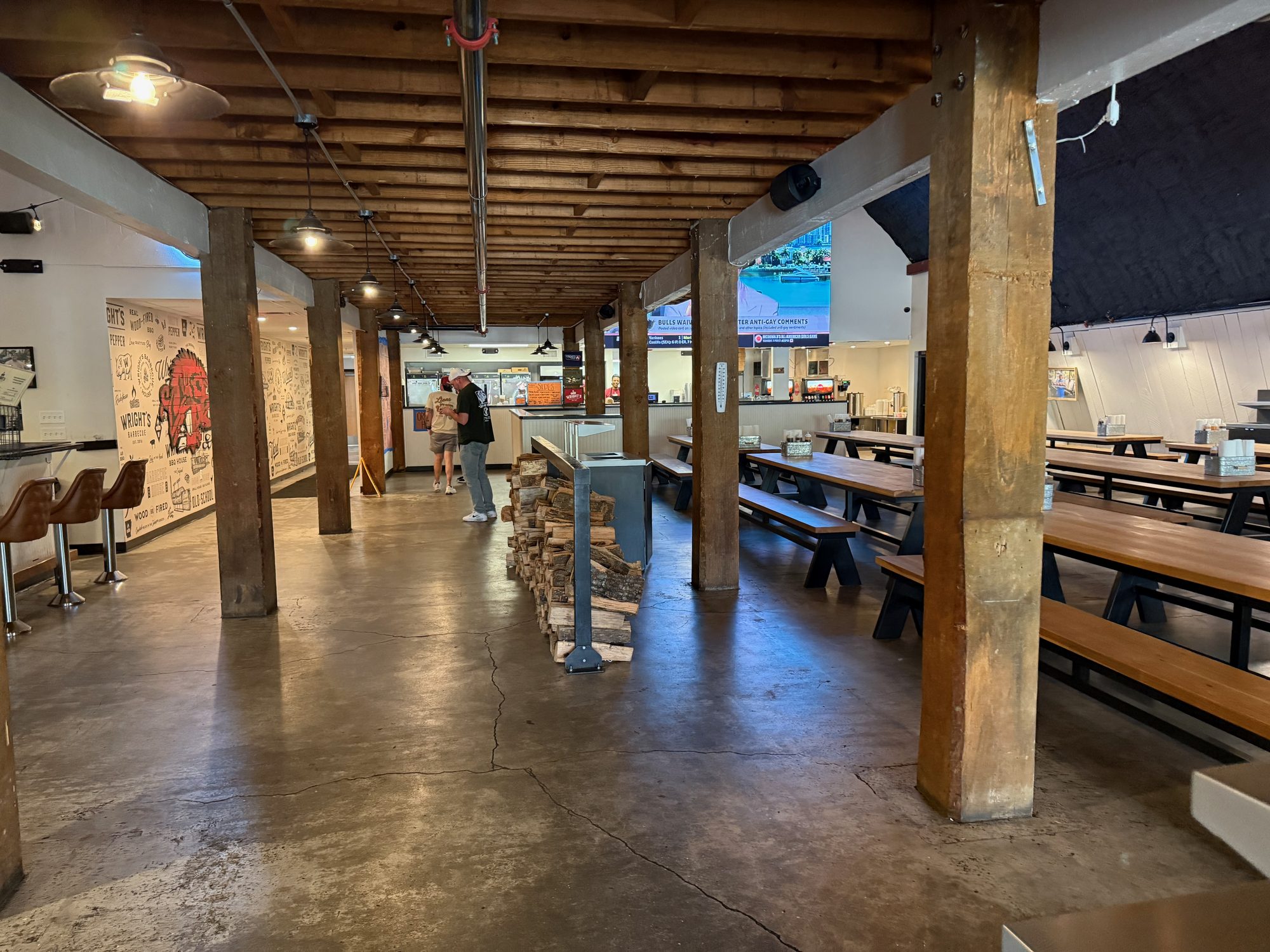 Rustic timber dining hall with communal tables in a small-town restaurant