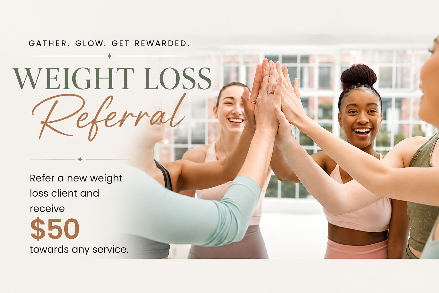 Group of smiling women in activewear giving a high five together indoors.