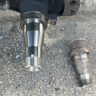 A new spindle shown beside the old spindle. This image shows our before and after.