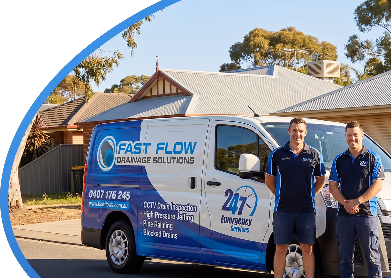 Two men stand beside a Fast Flow Drainage Solutions van offering 24/7 emergency drainage services.