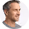 Middle-aged man with short brown hair looking to the right against a white background.