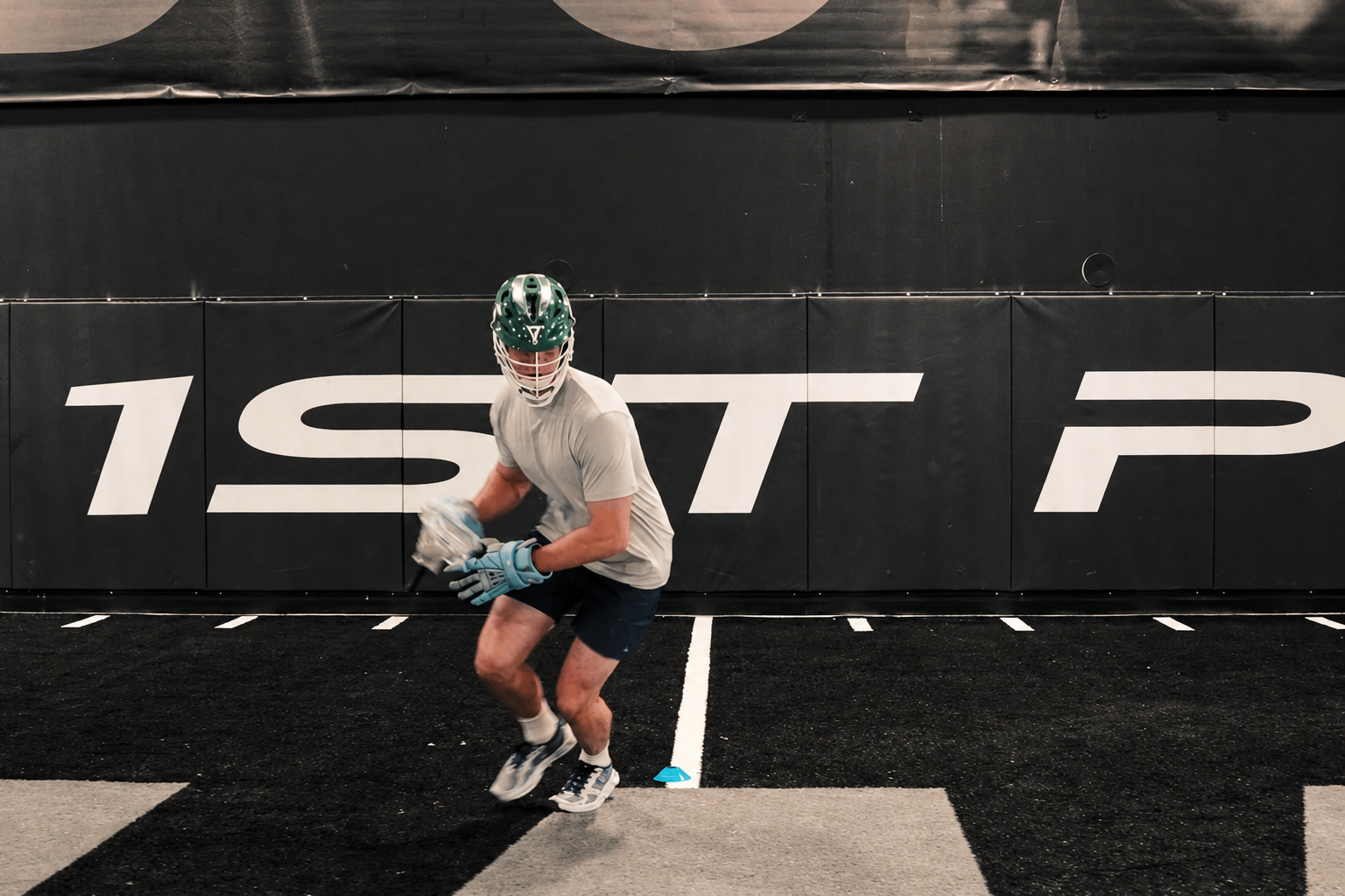 A Perfect Fit athlete training in lacrosse gear at 1st Phorm