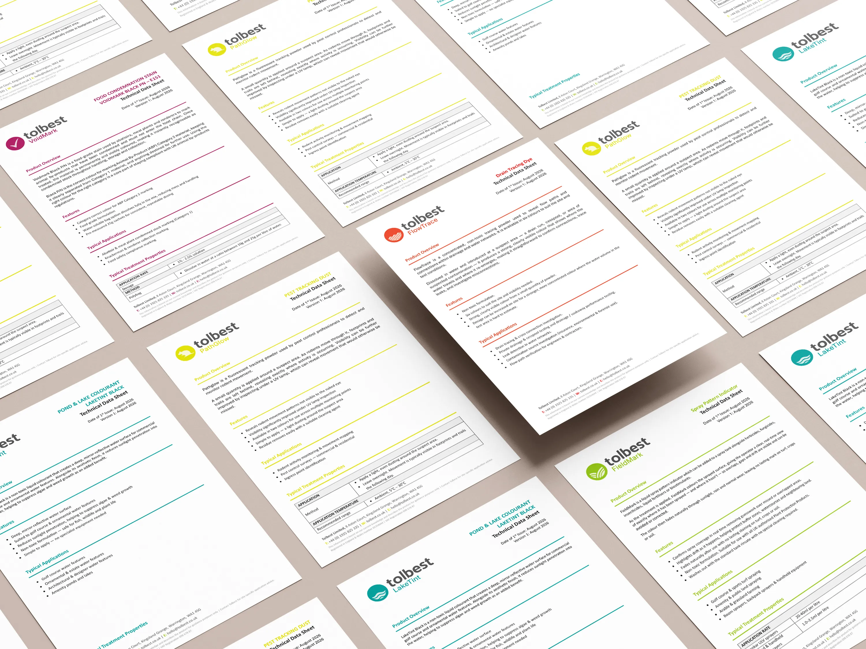 Multiple A4-sized Tolbest product data sheets laid out diagonally on a beige surface, each featuring the Tolbest logo and product-specific content with headings, bullet points, tables, and colored accents in yellow, red, teal, green, and maroon.
