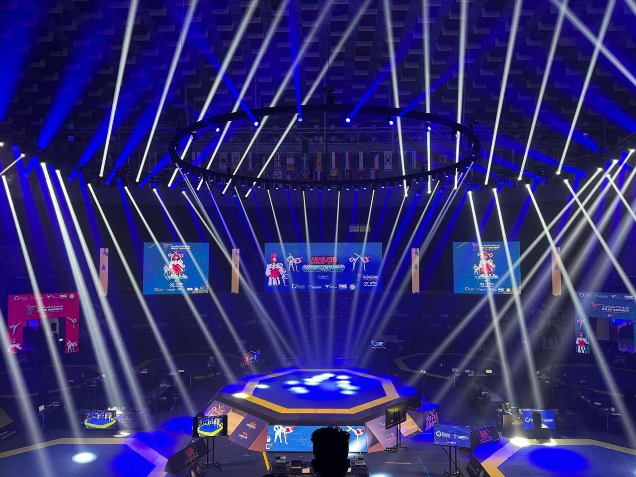 Arab Cup Taekwondo Championship arena with a lit field of play, LED screens and beam lighting, built by Ray Event Management
