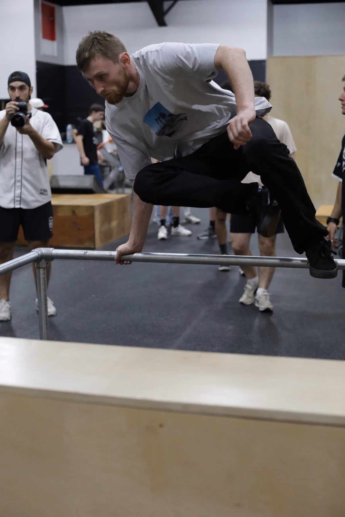 Athlete practicing a rail vault at HUB Parkour Sudbury.