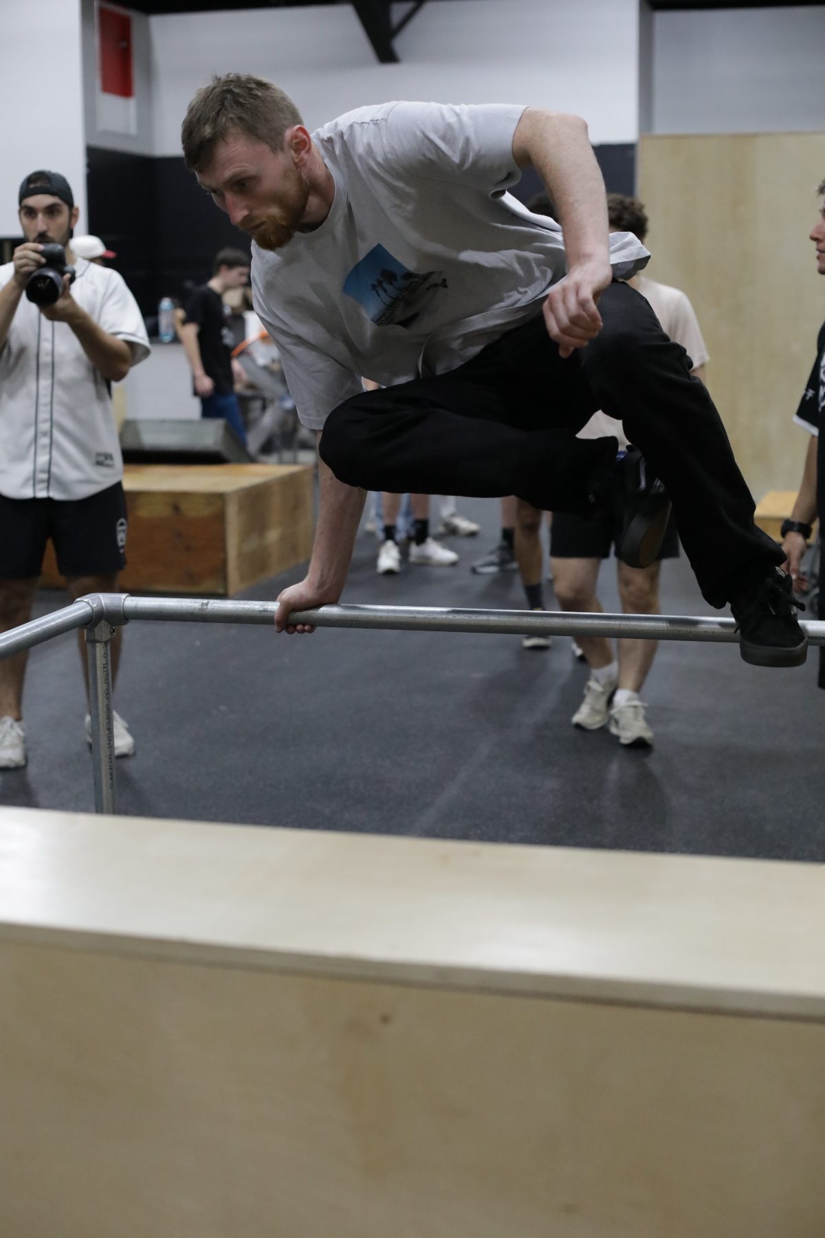 Athlete practicing a rail vault at HUB Parkour Sudbury.