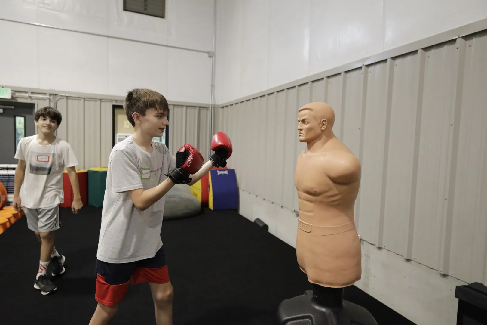 Campers take turns on the punching bag during game time