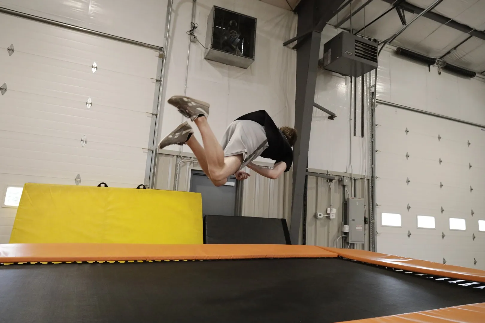 A camper flips off the trampoline