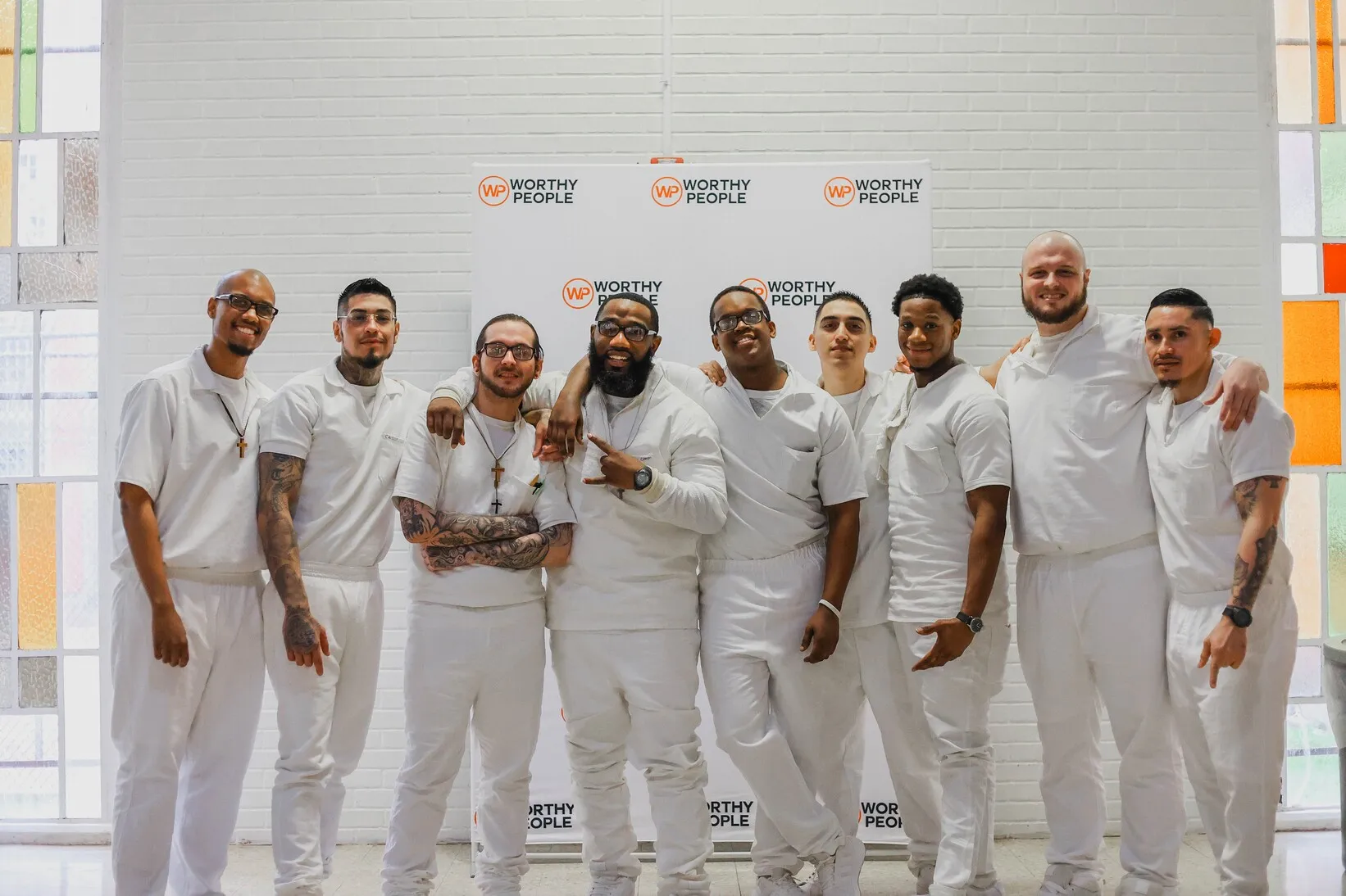 Group of men in white uniforms at Worthy People event