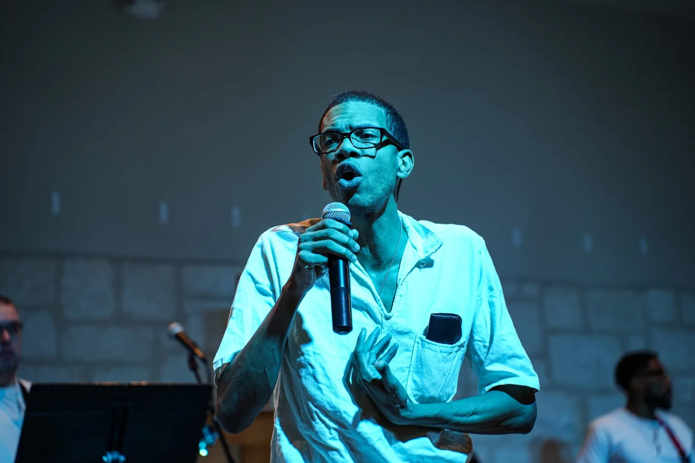 Inmate singing into microphone during worship service