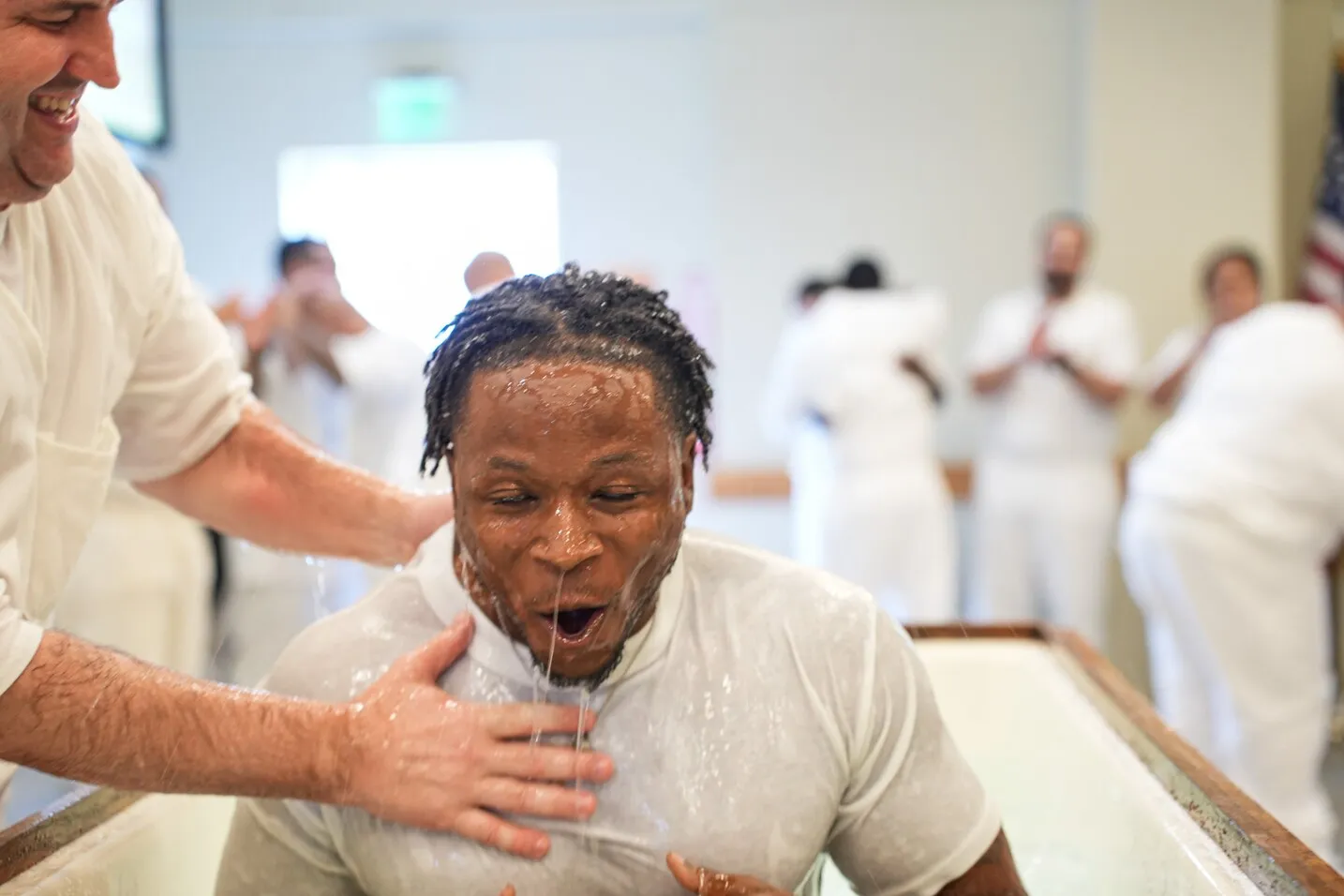Man baptized in water at Worthy People prison ministry service