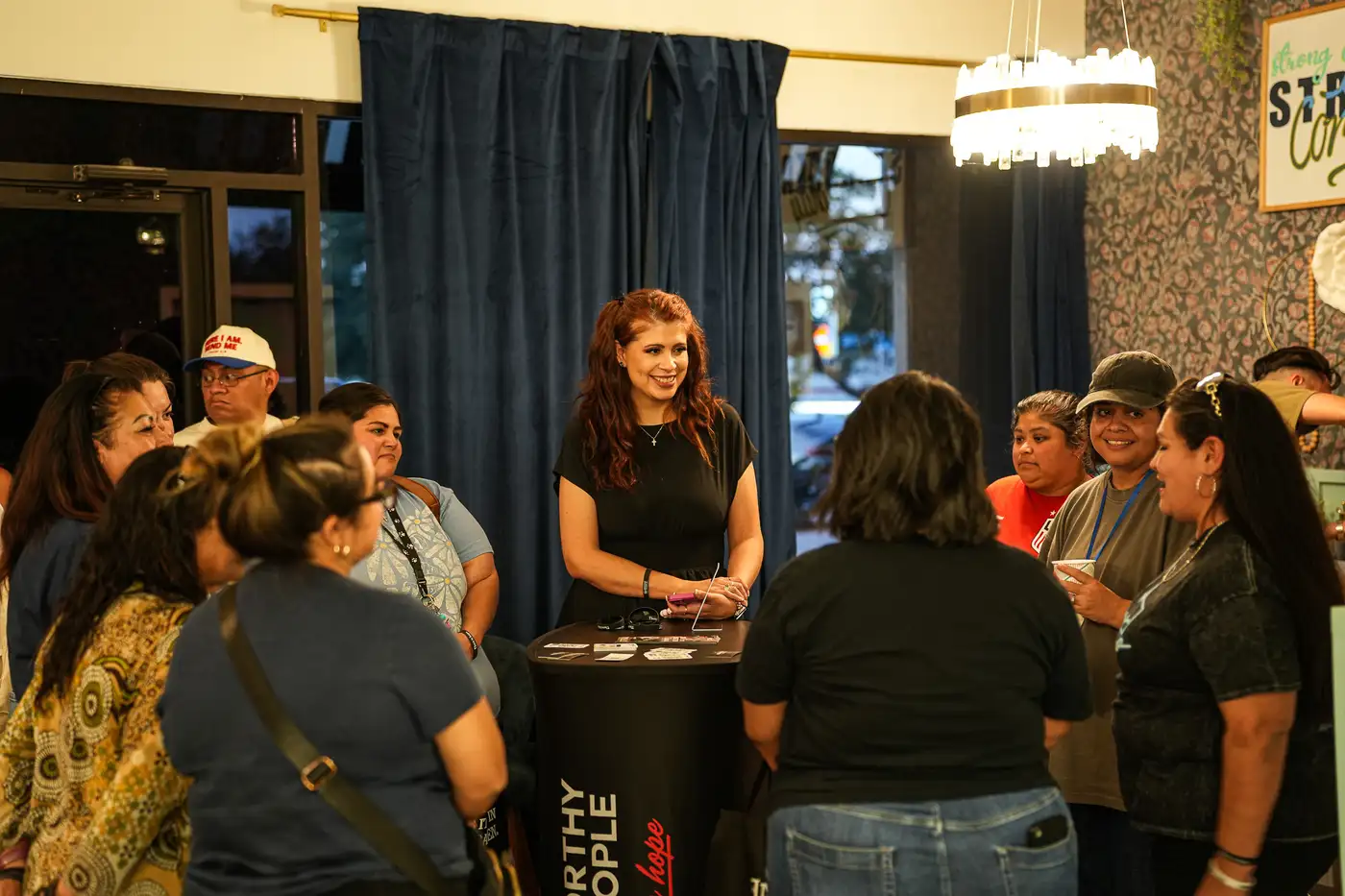 Speaker addressing a crowd at Worthy People event