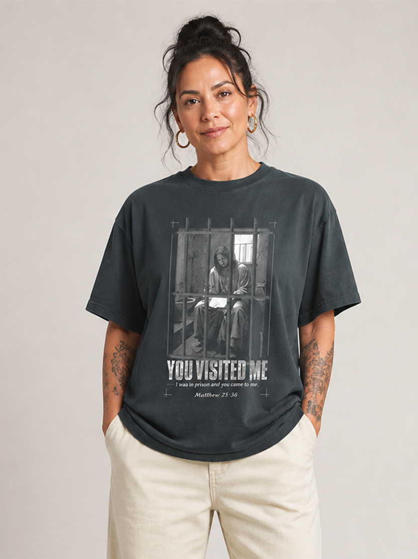 Matthew 25:36 tee with a powerful reminder — those in prison are not forgotten.