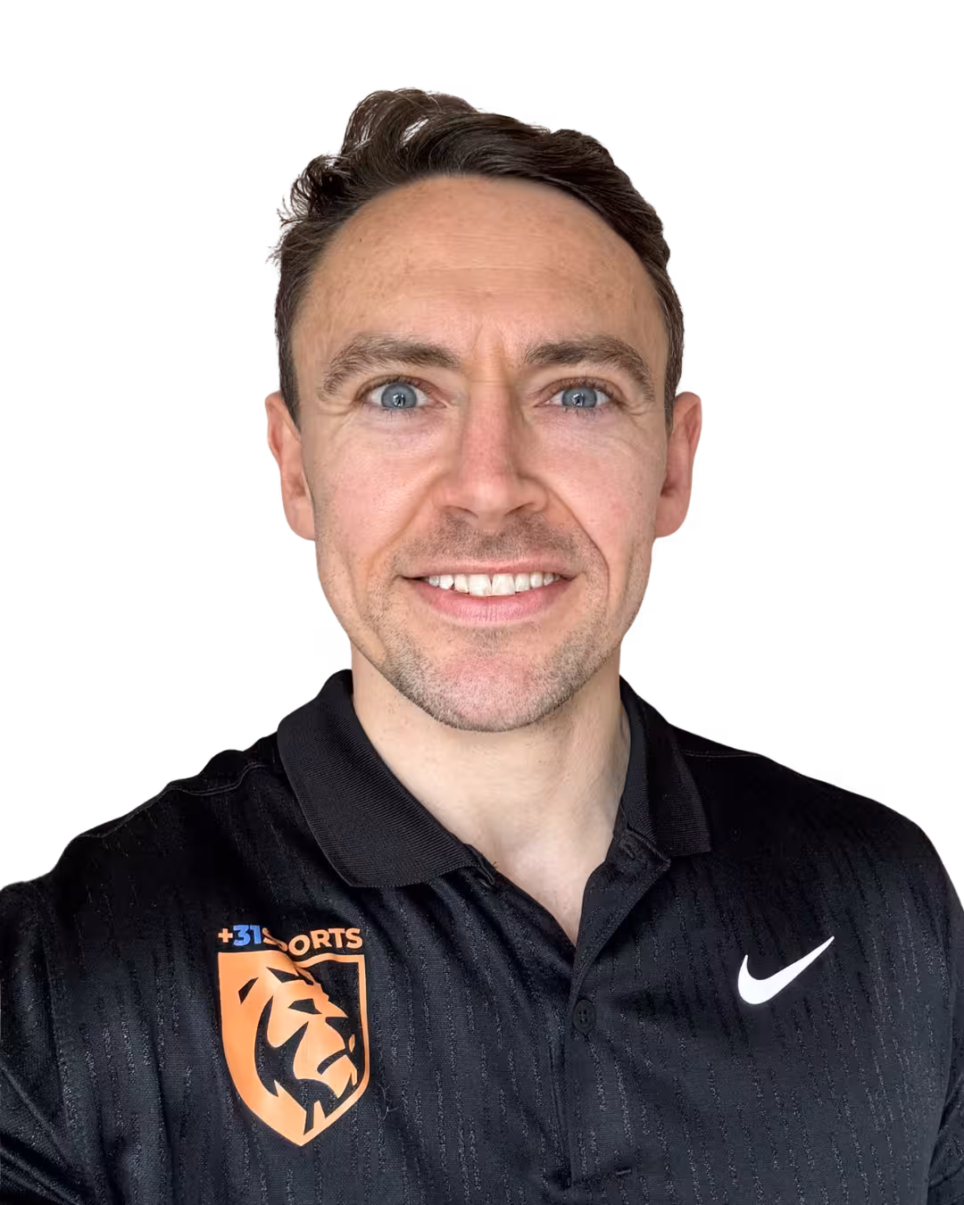 Man with blue eyes smiling, wearing a black Nike polo shirt with an orange lion sports logo.