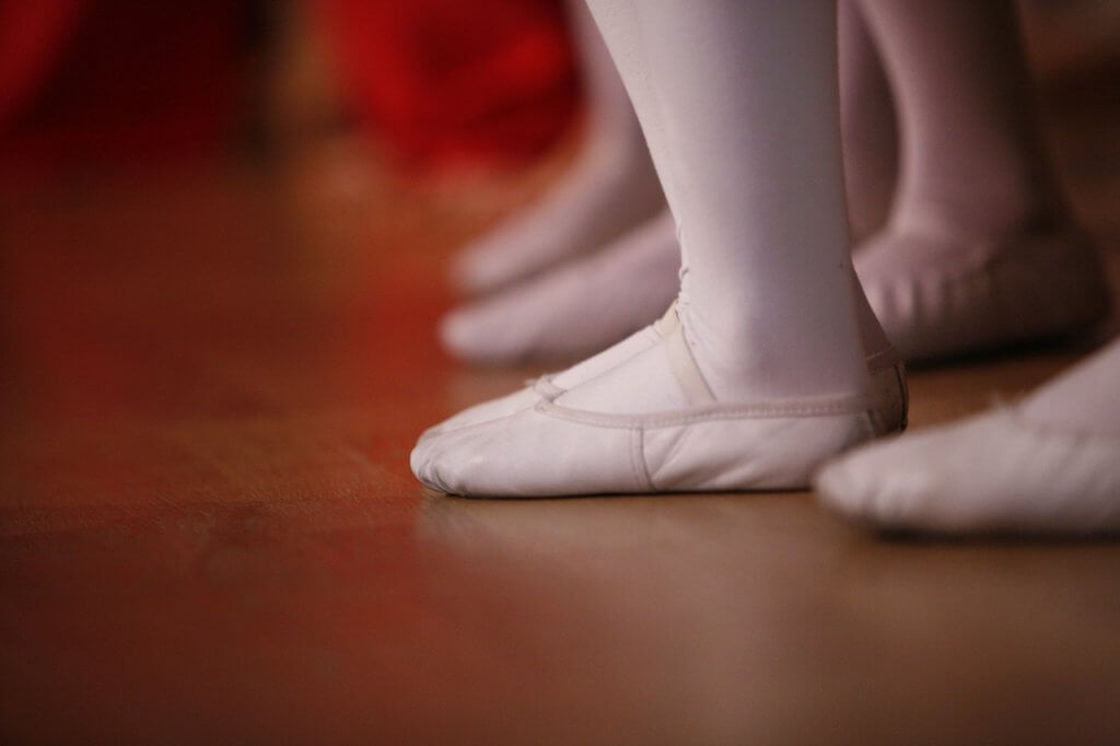 Ballet shoes on a wood floor