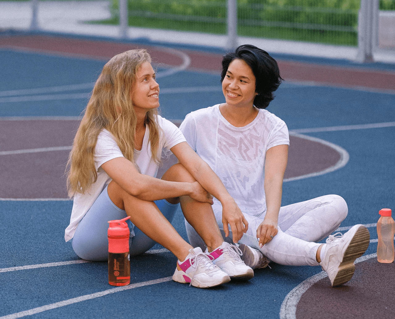 Woman with her mentor on a basketball court