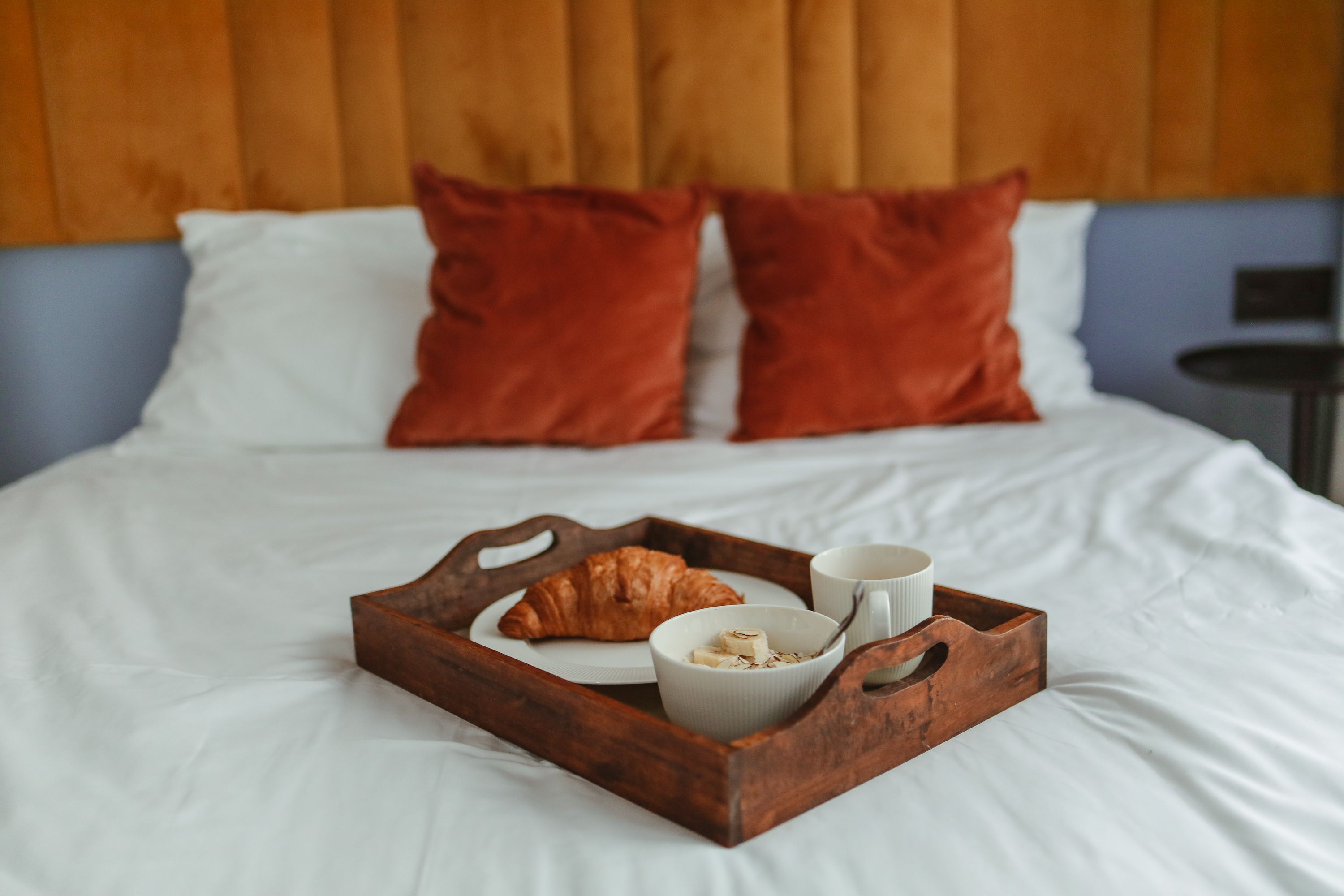 Bed with orange pillow stock image