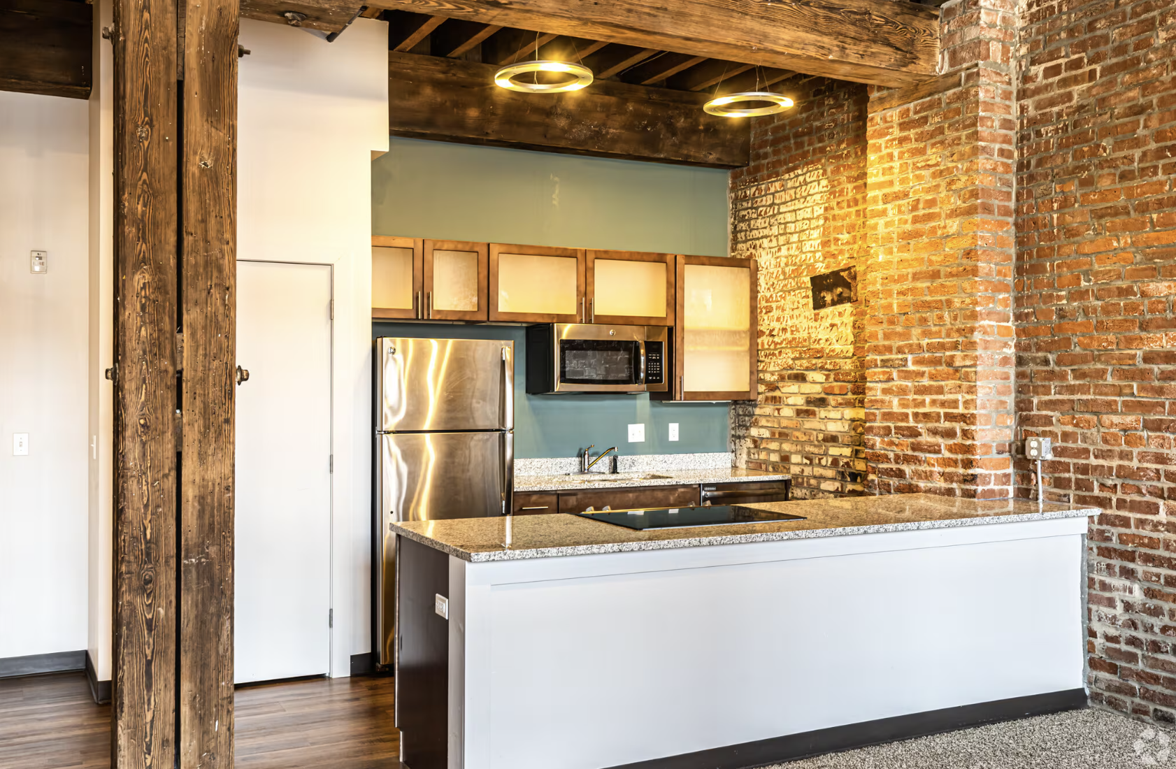 Kitchen with brown cabinets and counter