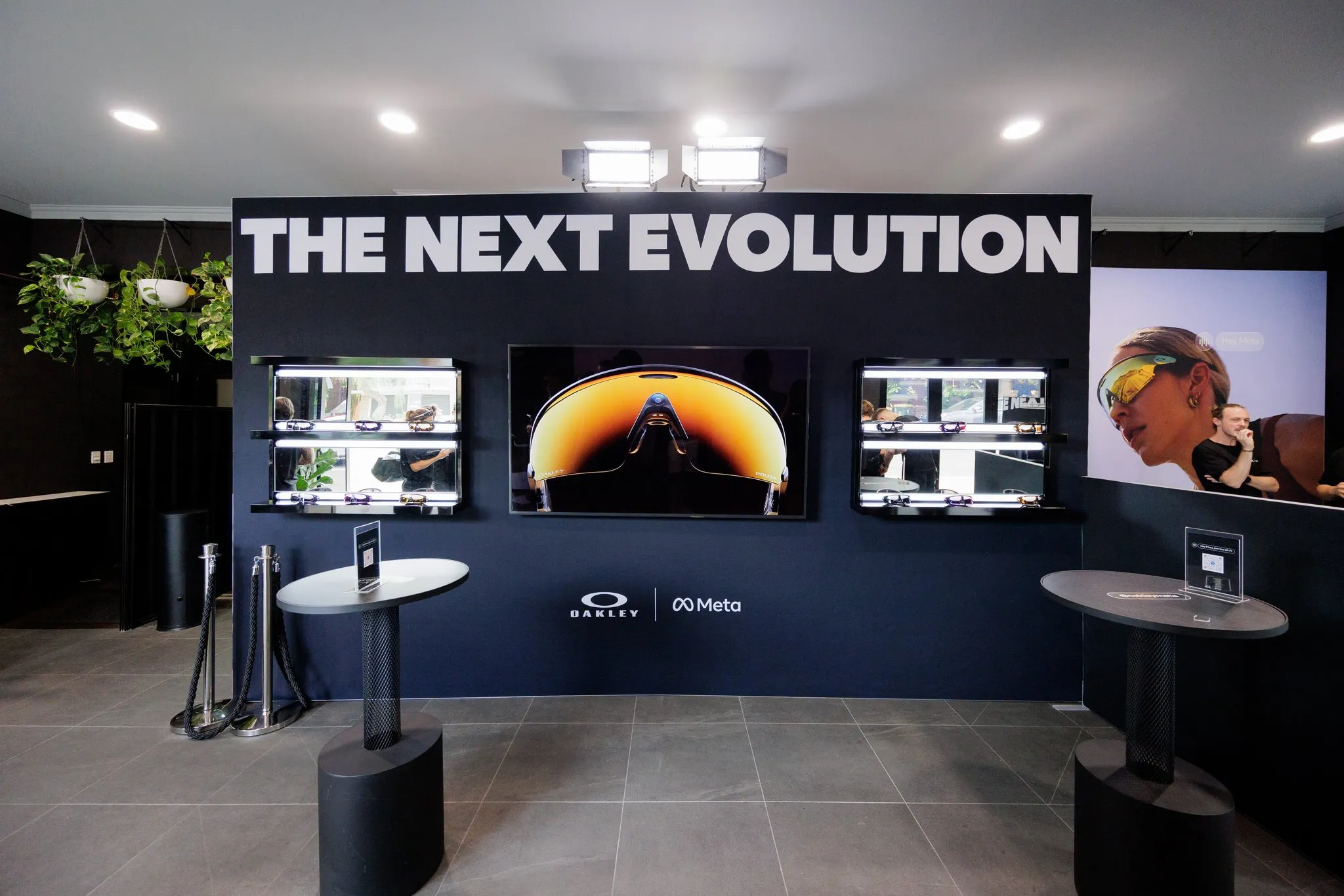 THE NEXT EVOLUTION signage above Oakley Vanguard product displays.