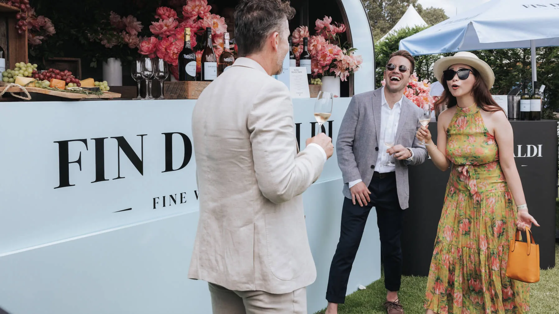 Guests sample wine beside the Fin D’Itinaldi branded bar.
