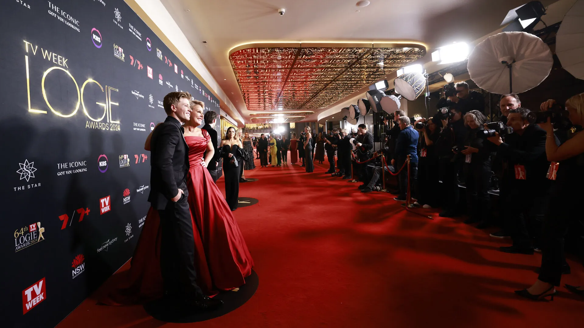 Guests pose for photographers on the TV Week Logies red carpet.