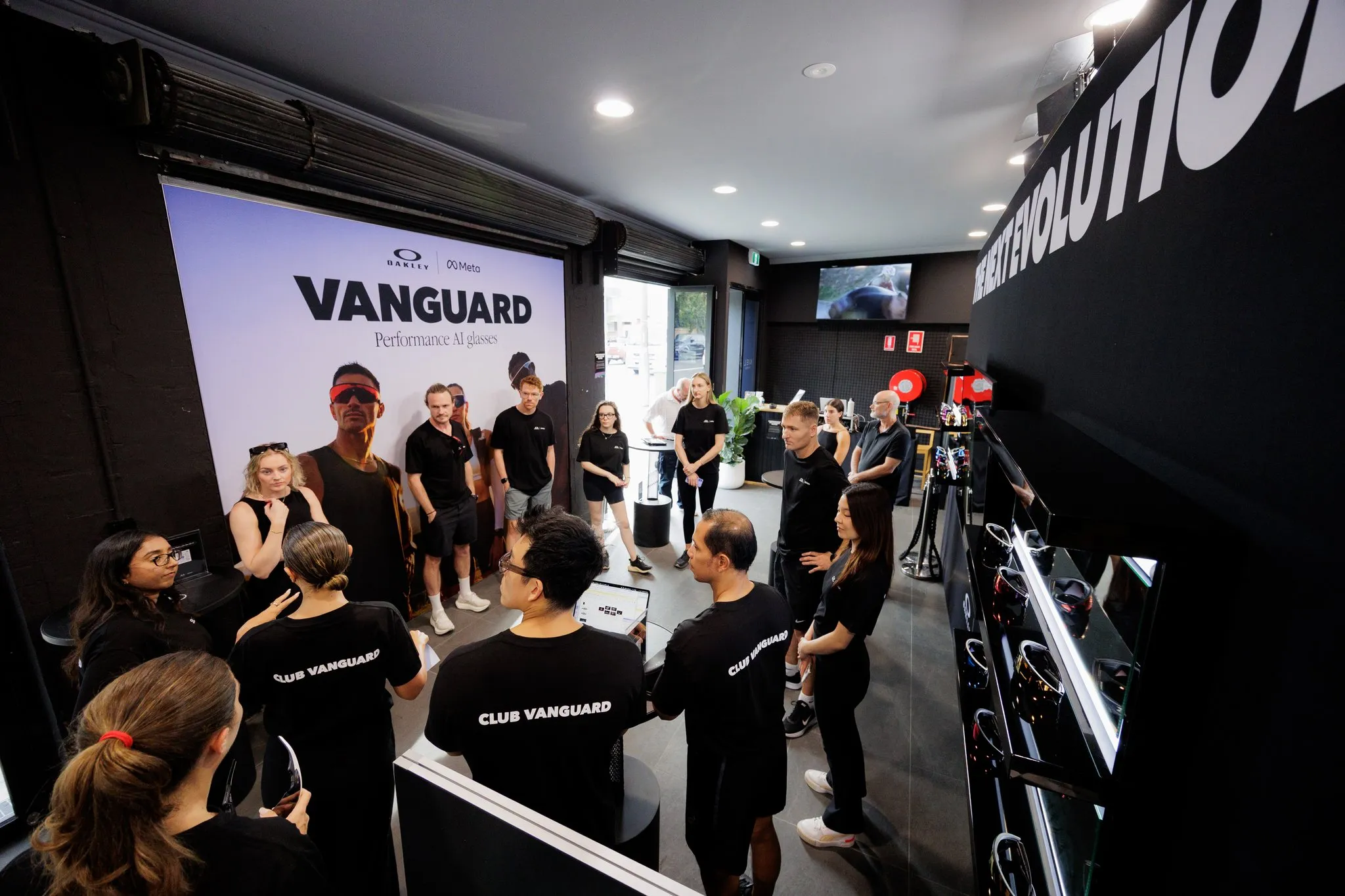 Guests gather beside the Vanguard display inside the launch venue.