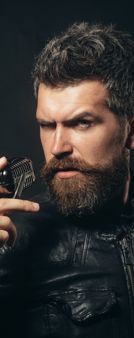 Man Holdinf Scissor And Comb
