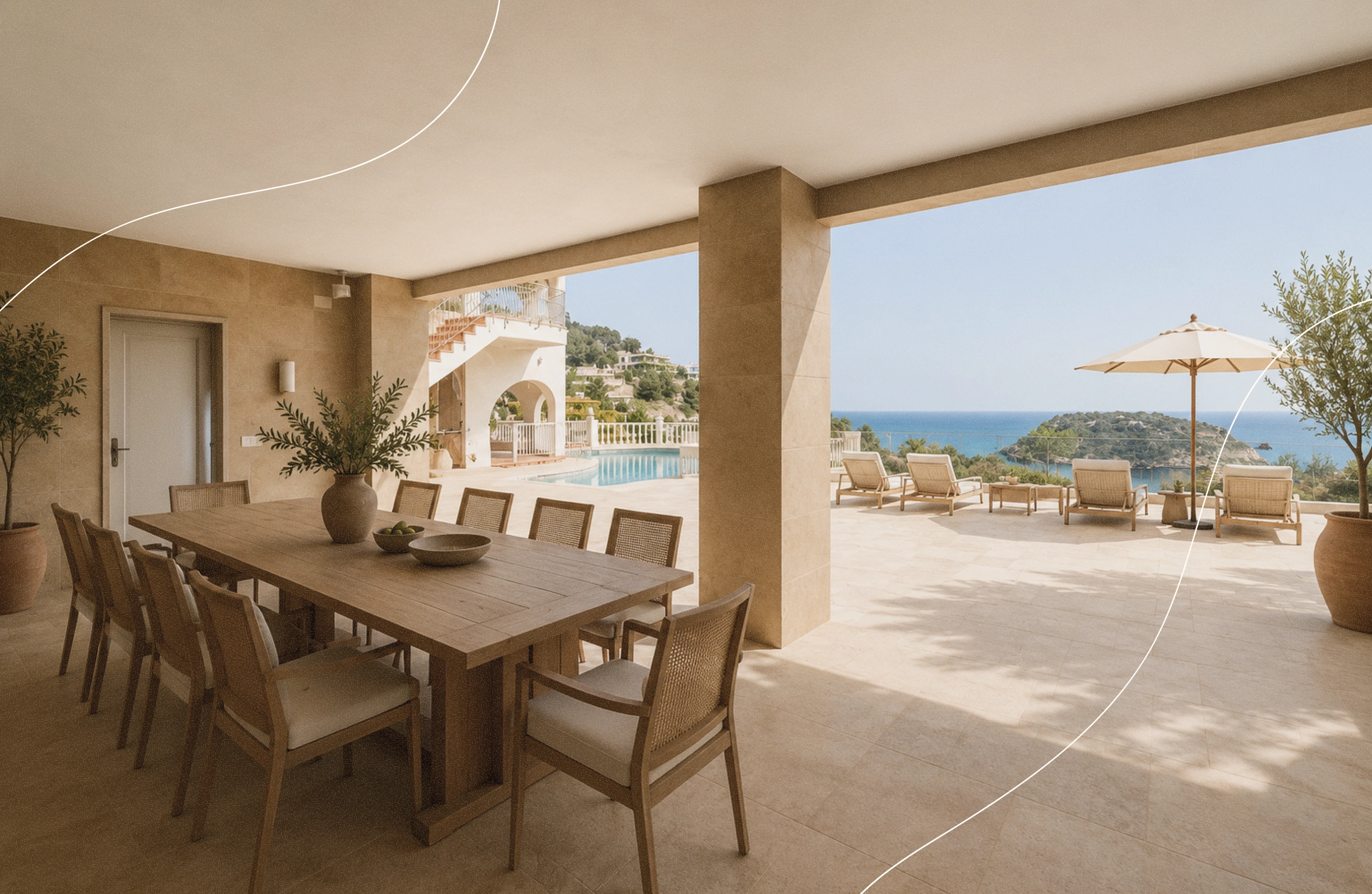 Covered outdoor dining area with a long wooden table and ten chairs, decorated with a vase and bowls, opening onto a sunlit terrace featuring lounge chairs, large umbrella, and a view of a swimming pool, distant greenery, and the sea under a clear sky.