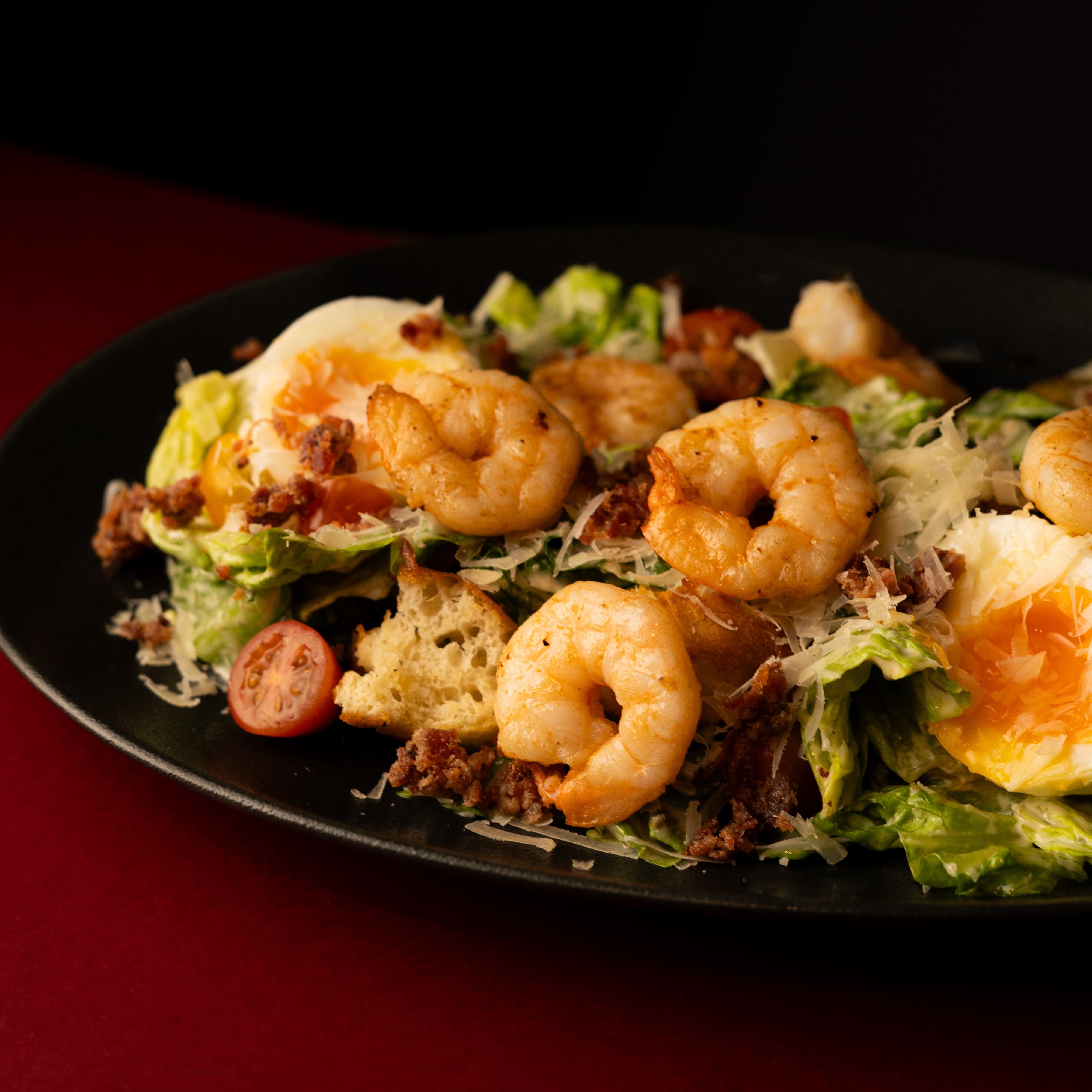 Classic Caesar salad with chicken or shrimp, parmesan and romaine lettuce at ANTARES Lounge