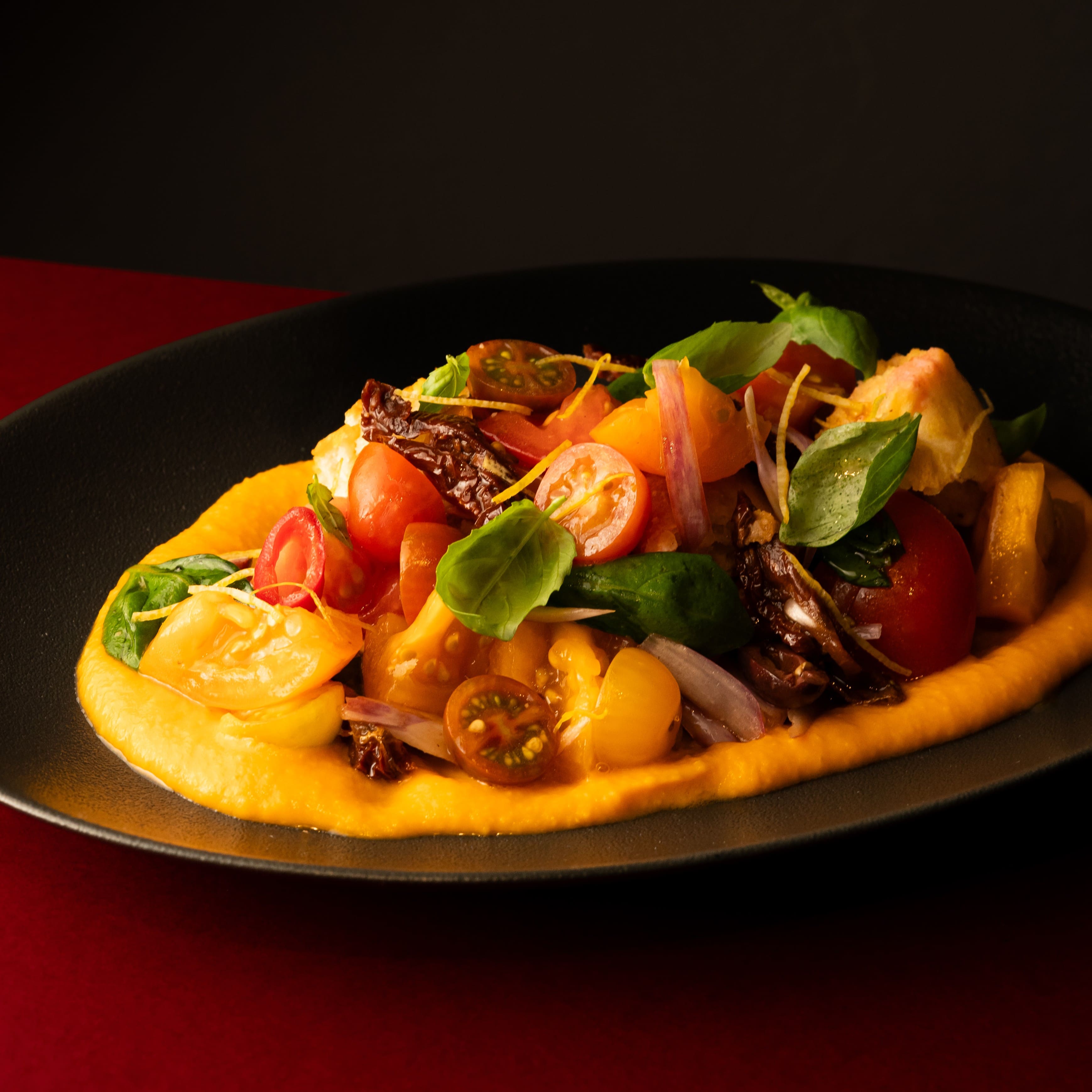 Italian Panzanella salad with tomatoes, olives and basil at ANTARES Lounge