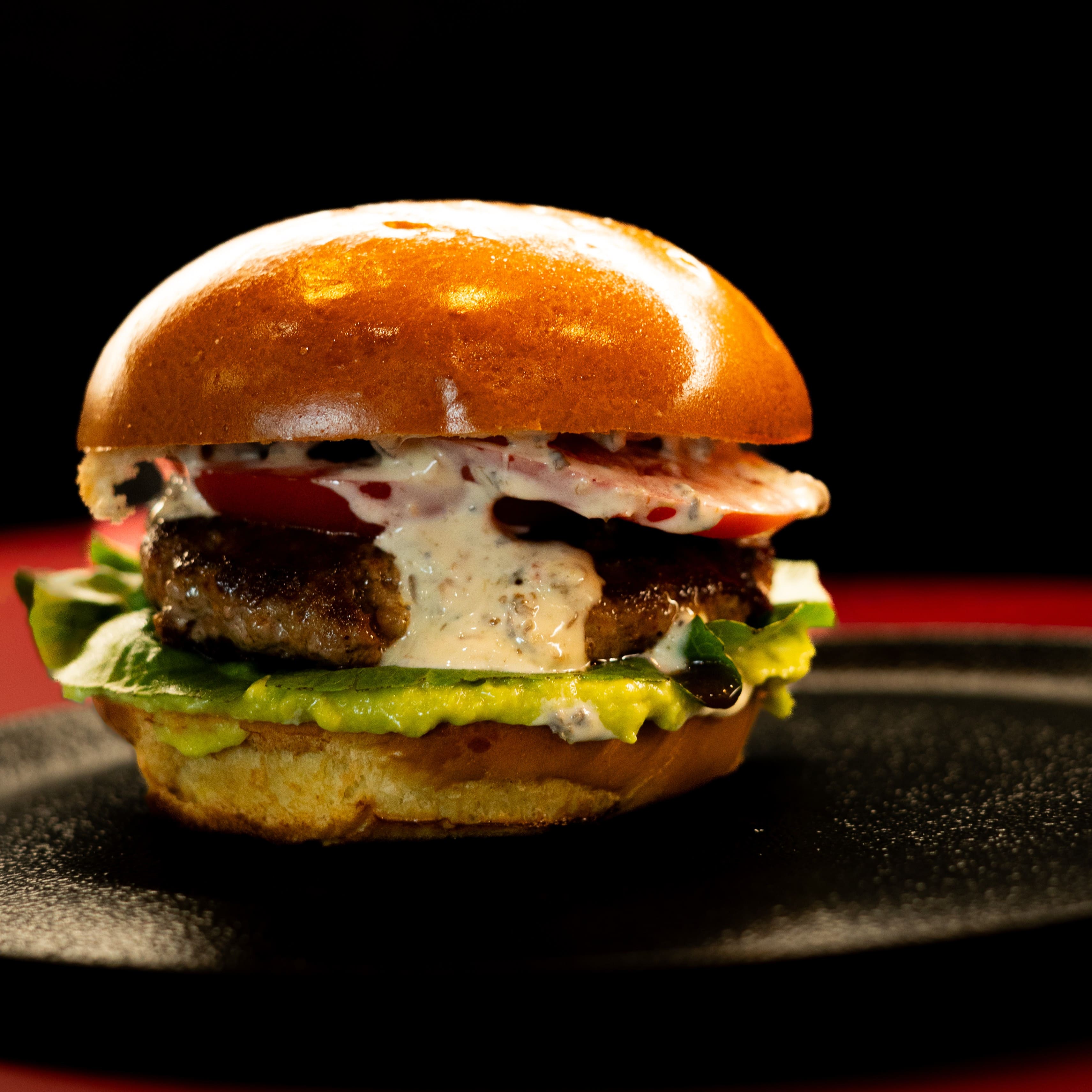 Truffle smash burger with caramelized onions and truffle mayonnaise at ANTARES Lounge