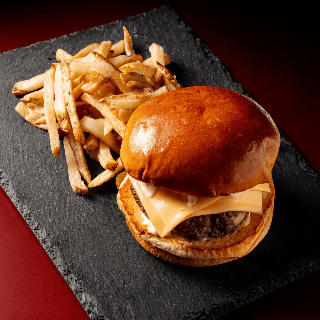 Spicy smash burger with bacon, cheese and sriracha mayonnaise at ANTARES Lounge