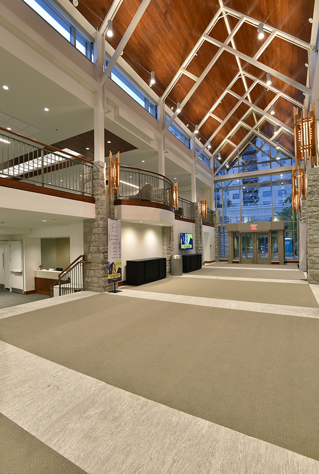North Avenue Presbyterian Church lobby with timber-truss ceiling and stone columns