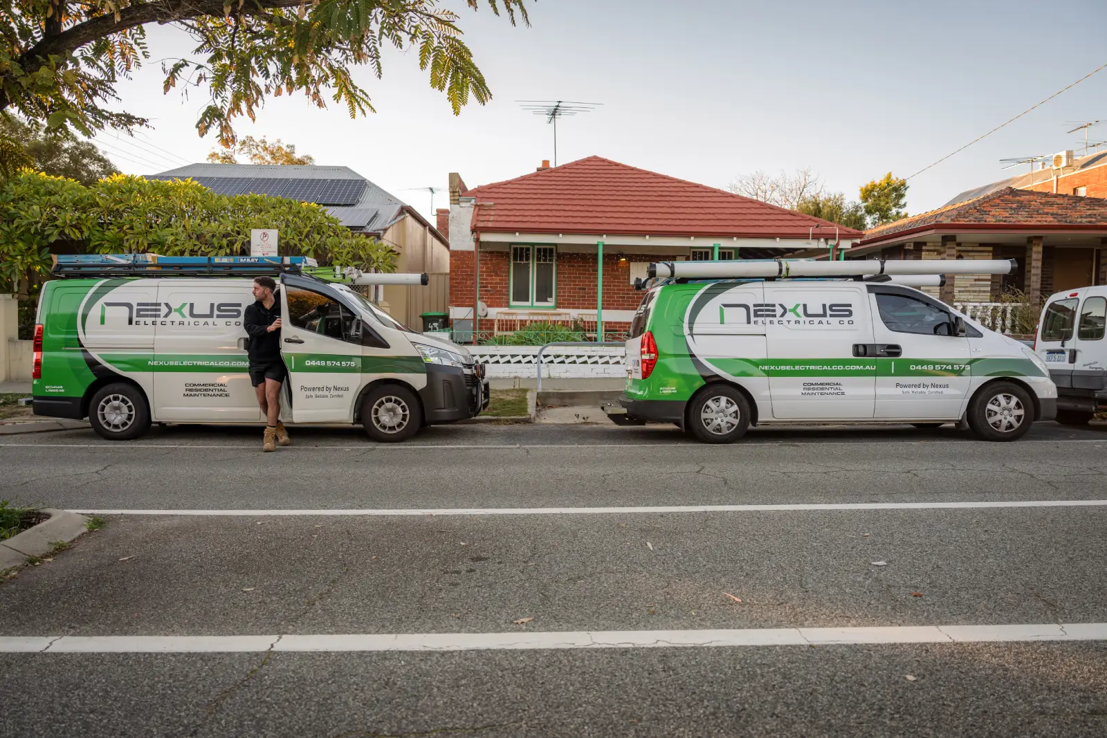 Nexus Electrical Co service vans and electrician at a residential property in Woodlands