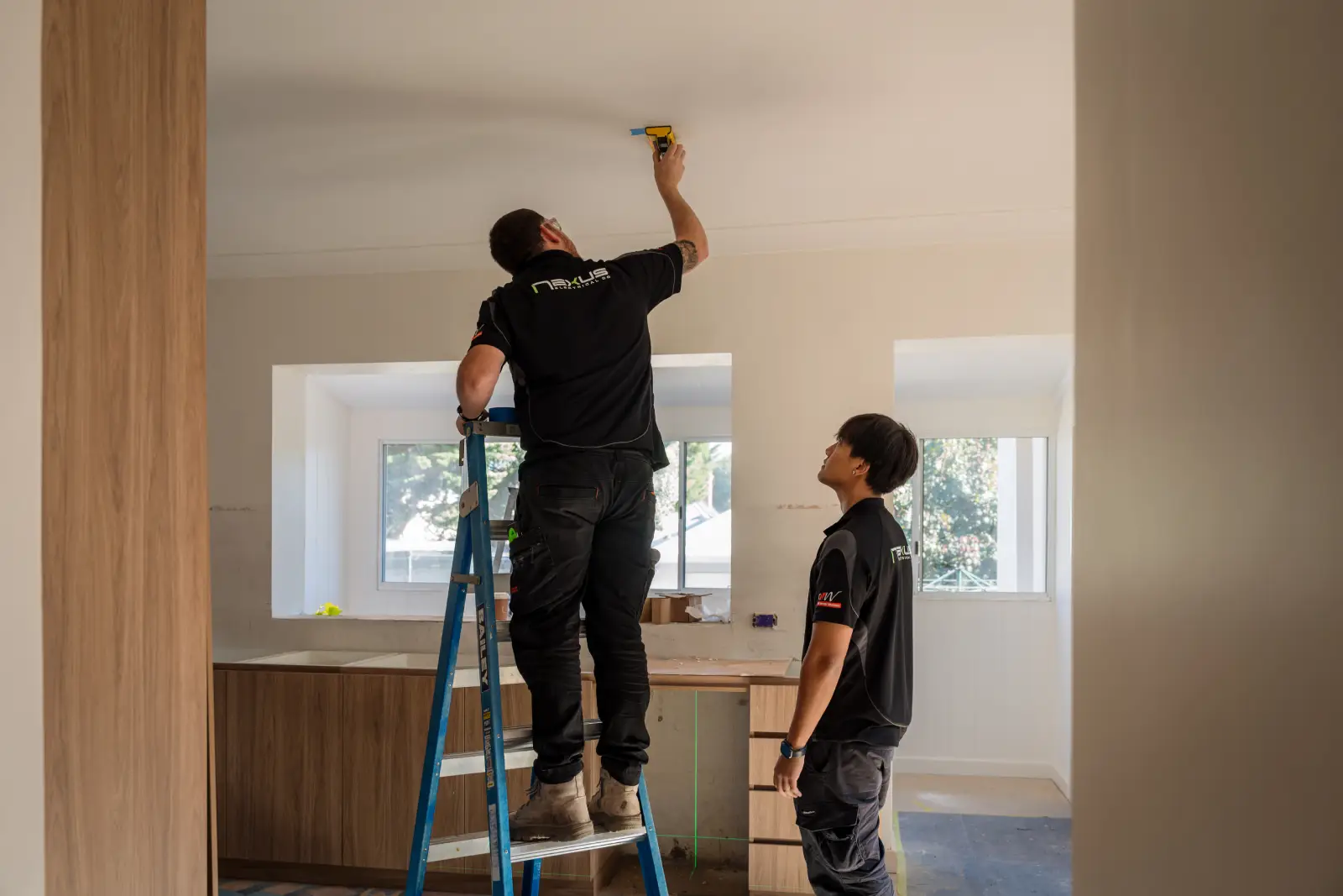 Nexus Electrical Co electricians working on a residential electrical installation in Floreat