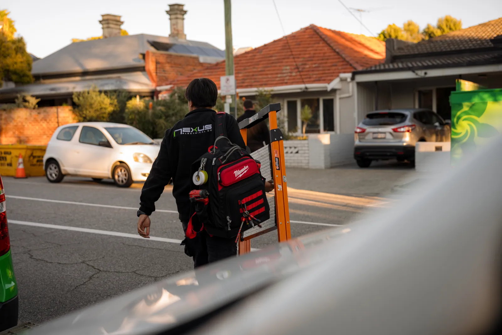 Nexus Electrical Co electrician arriving at a residential job with tools in Scarborough