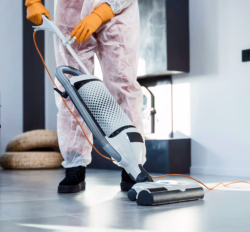 All Bright cleaning technician dusting a living room in a San Jose home