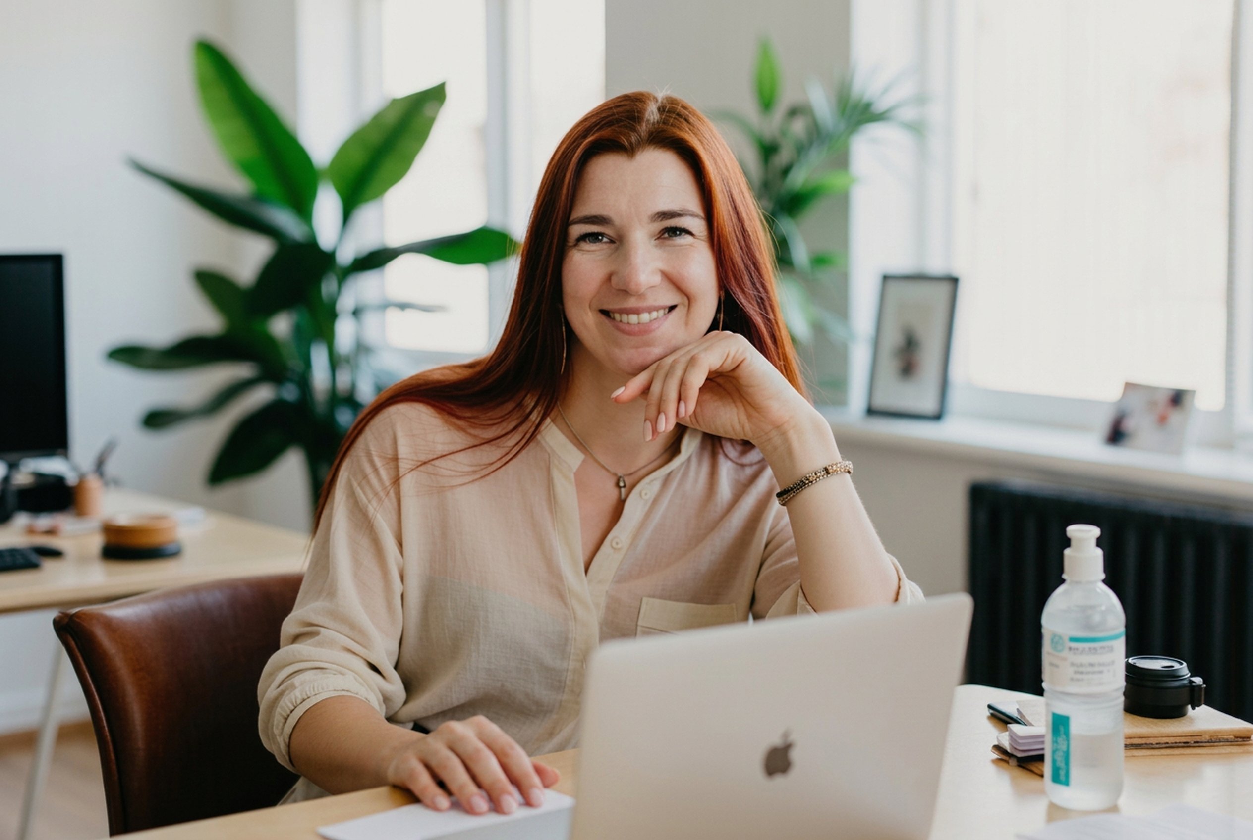 UNCOM support specialist working at a laptop