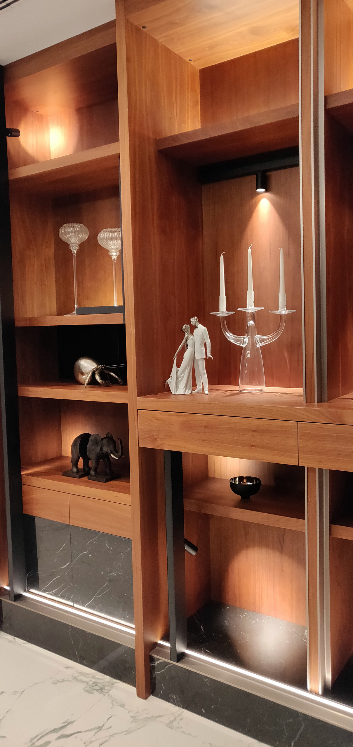 Illuminated built-in shelving with integrated accent lighting