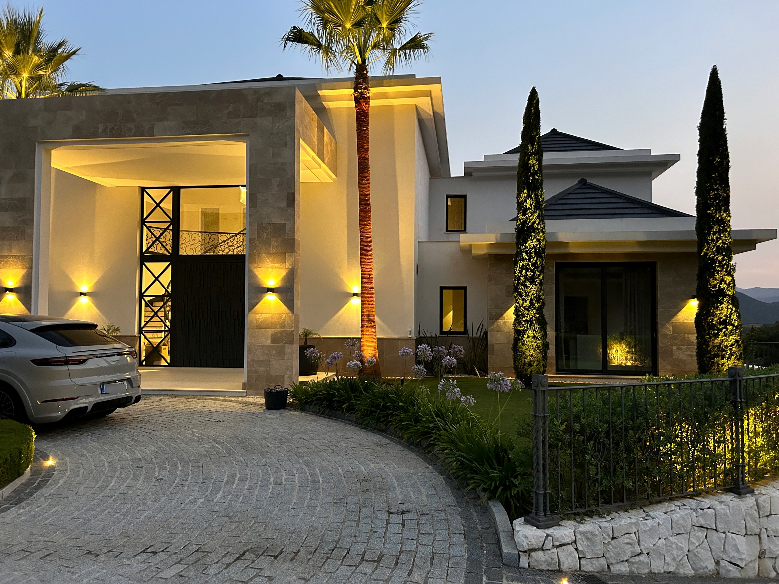 Front entrance of a modern villa with integrated exterior lighting