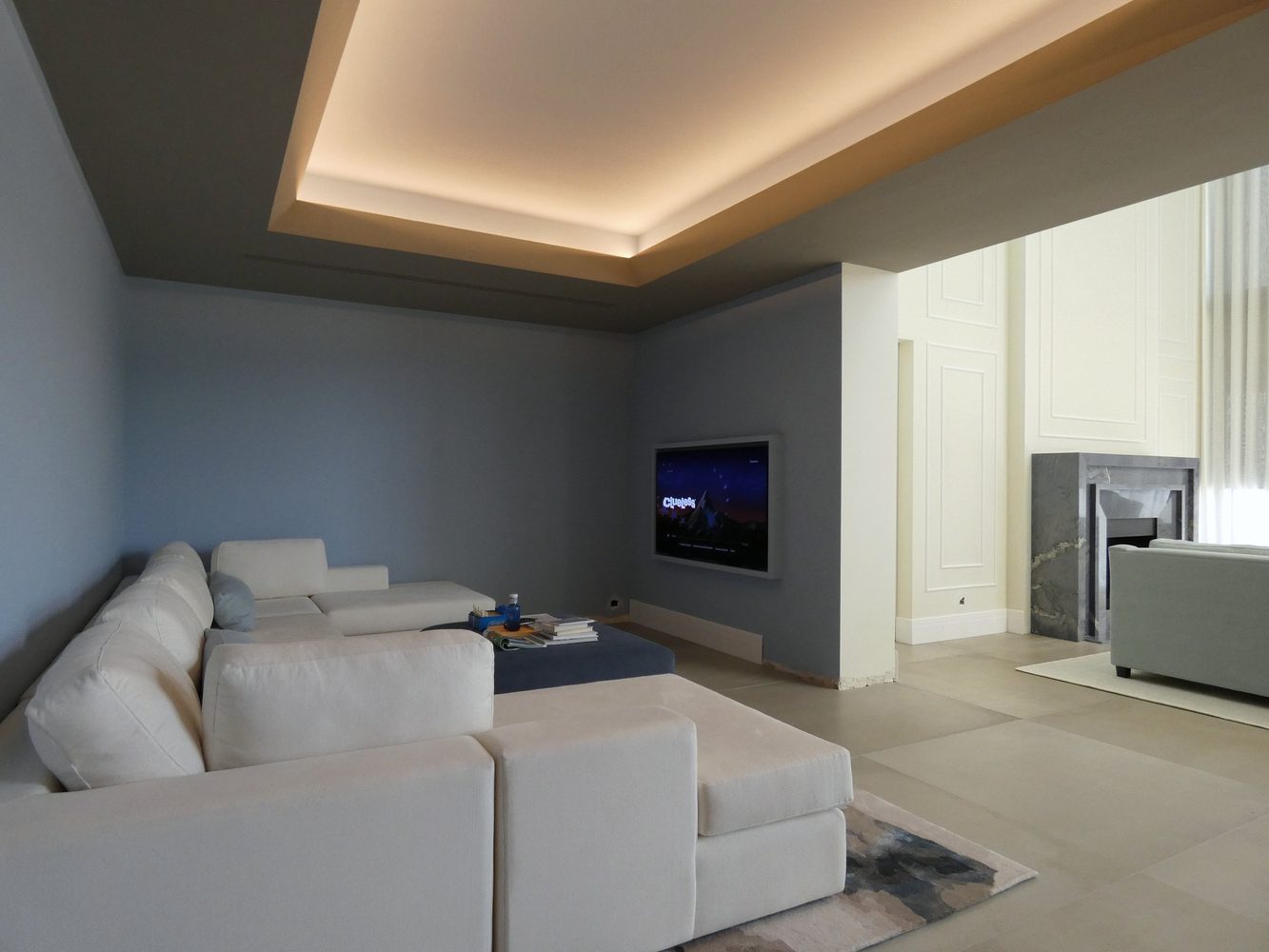 Media room with integrated ceiling lighting and television