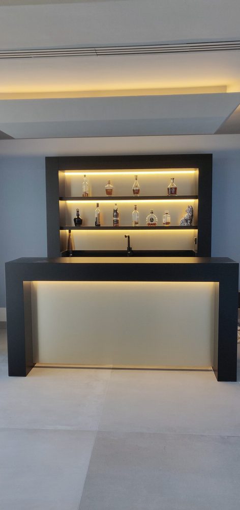 Backlit home bar with illuminated shelves