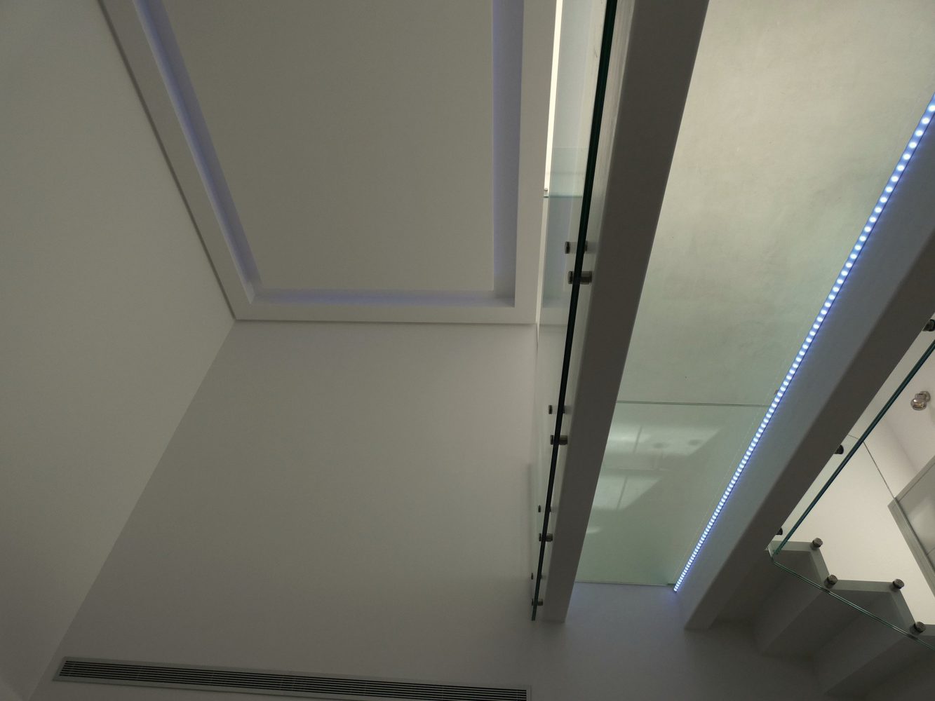 Blue linear ceiling lighting in an Estepona townhouse