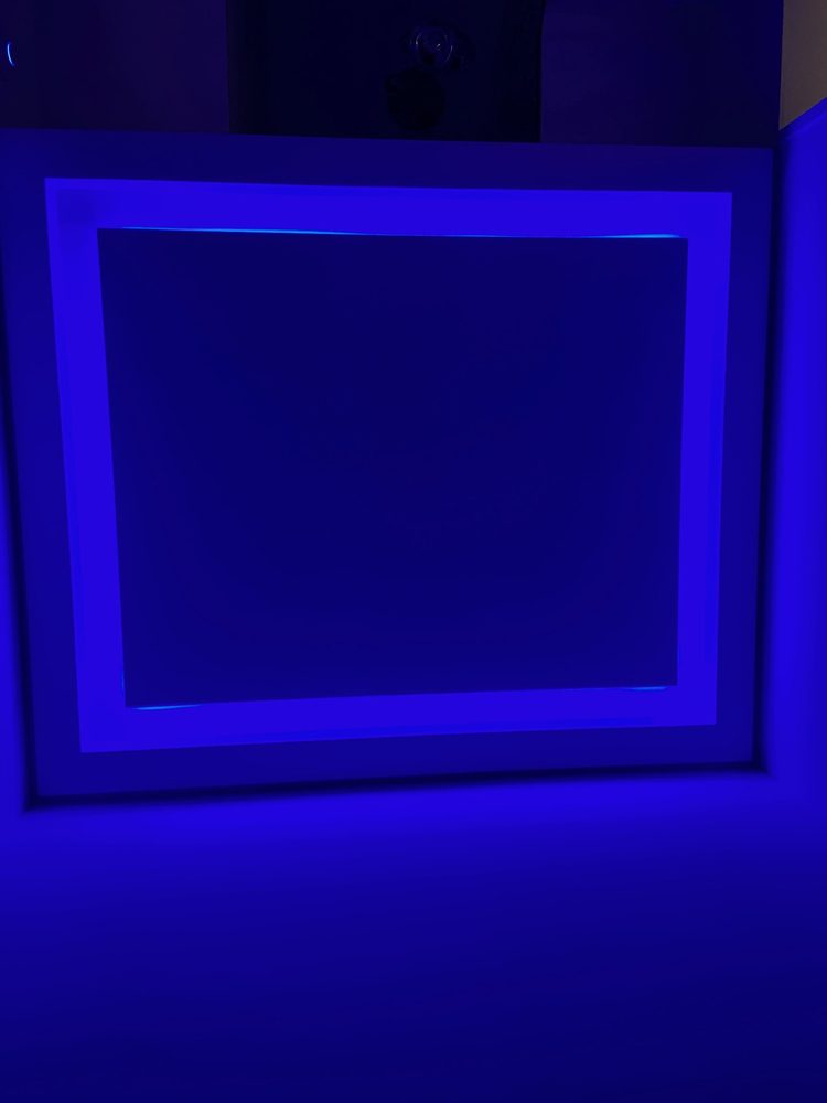 Blue illuminated wall detail in an Estepona townhouse