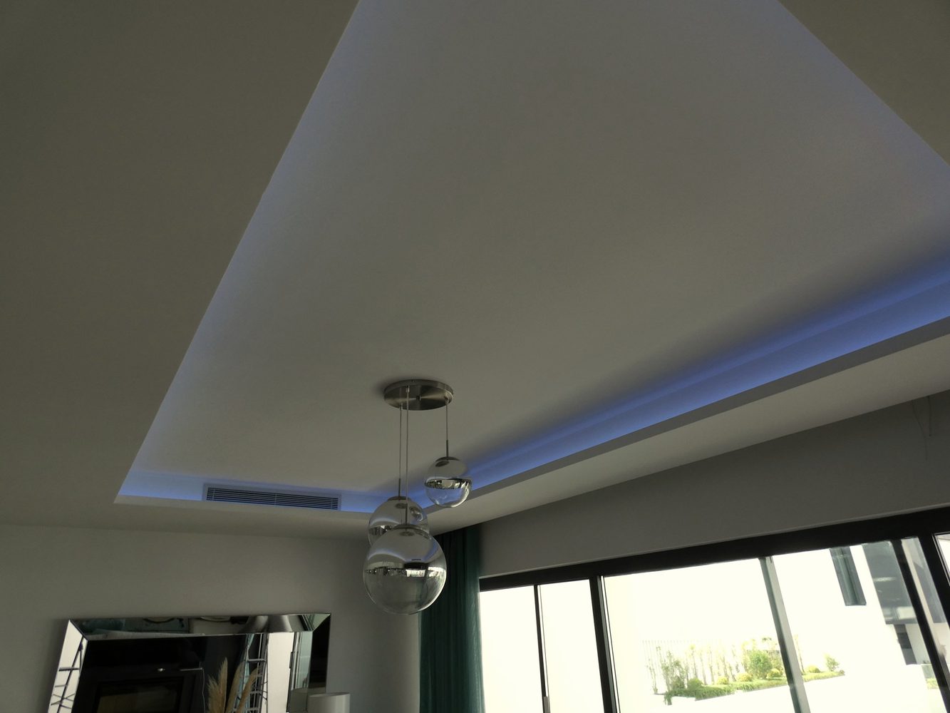 Blue ambient lighting in the living area of an Estepona townhouse