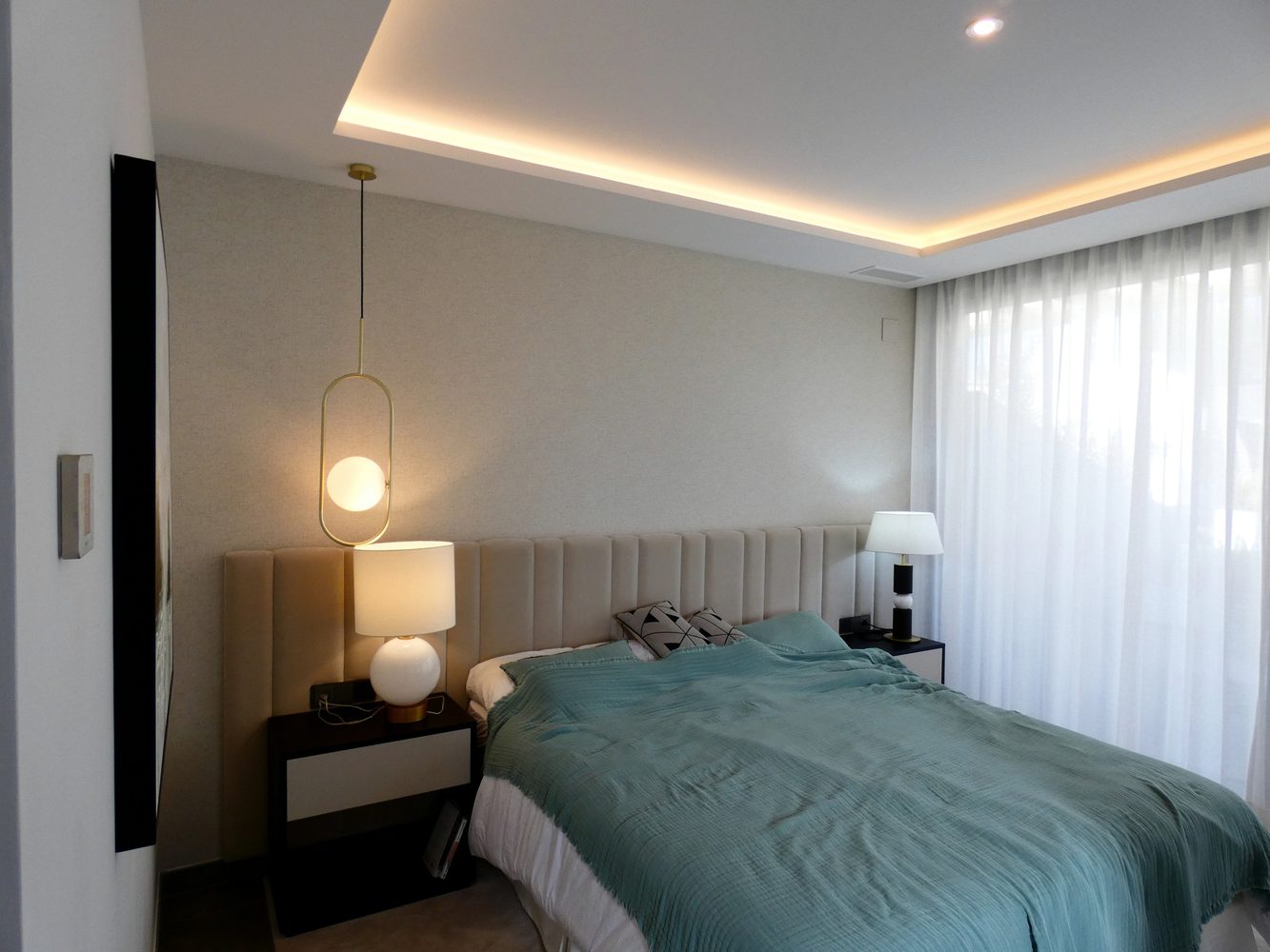 Bedroom with pendant, bedside and cove lighting layers