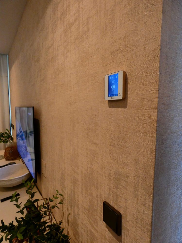 Climate control panel installed within the interior wall finish