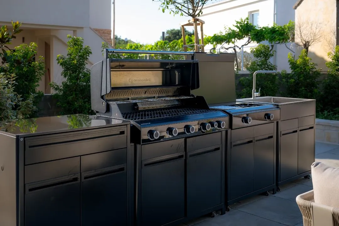 Outdoor kitchen with gas grill and sink